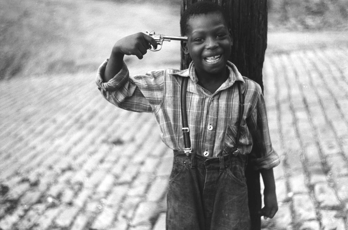 Boy With Pistol by Elliott Erwitt
